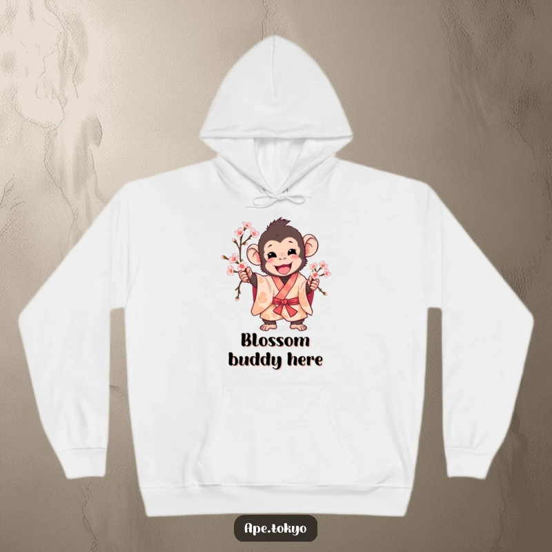 Funny ape in patterned kimono excitedly holding cherry blossom branch, cozy hoodie, warm design.