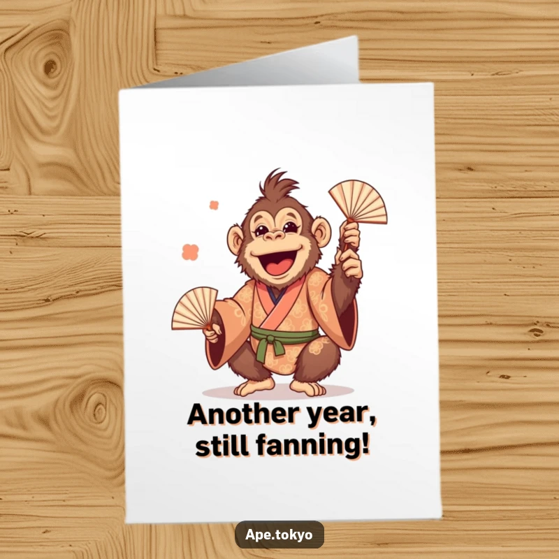 Funny Free Printable Birthday Card: Cheerful Orangutan in a patterned kimono, playfully juggling fans with a wide grin.