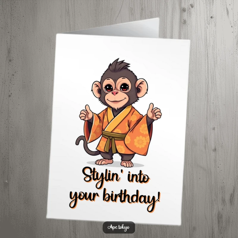 Funny Free Printable Birthday Card: Playful Macaque in an ornate kimono, striking a stylish, confident pose.
