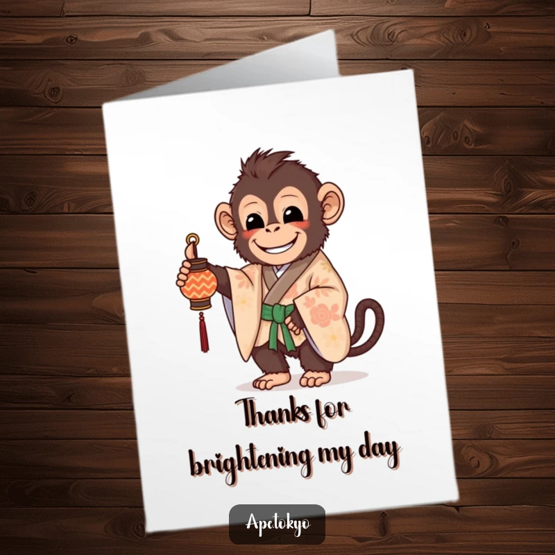 Free Printable Thank You Card: A beaming ape in a patterned kimono holds a small, decorated lantern, conveying thanks.